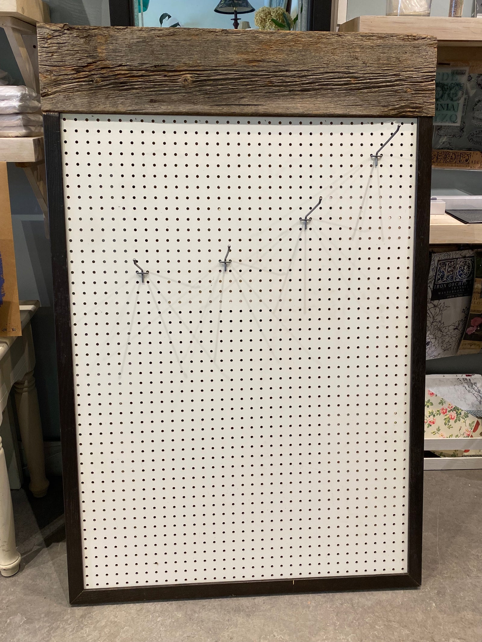 Custom Made Pegboard Display with Wood Top