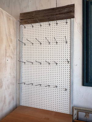 Pegboard with Attached Drawers on Wheels